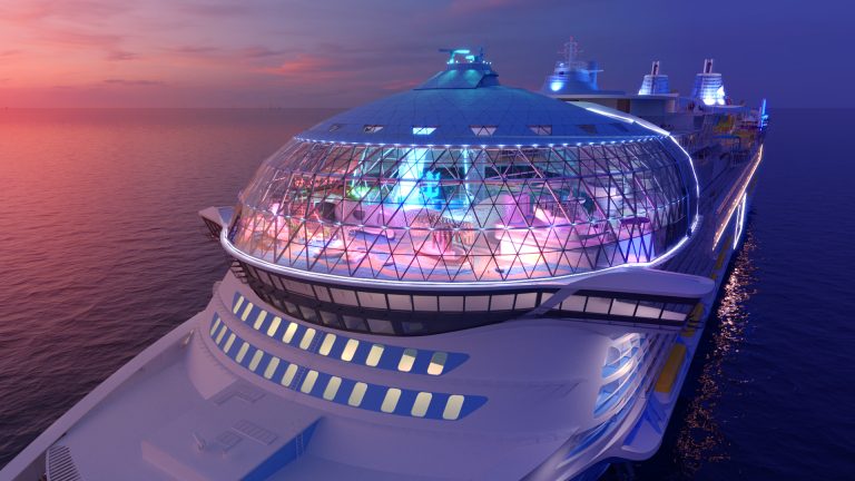 Render of a futuristic cruise ship dome glowing with neon lights over the ocean at sunset.